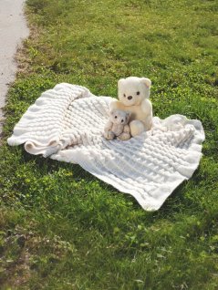 Plisséstickad babyfilt