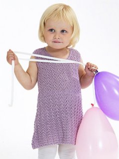 Mönsterstickad klänning