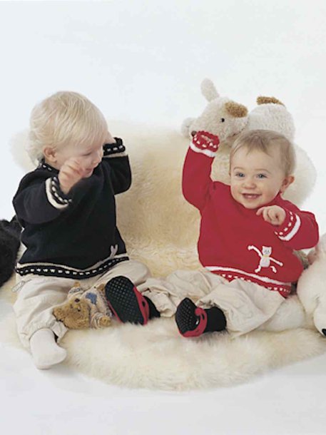 Slätstickad tröja med påsydd figur