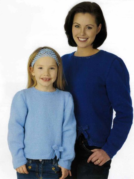 Jumper med påsydd rosett