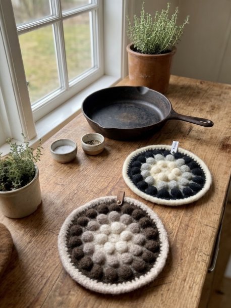 Virkad grytlapp med bubblor